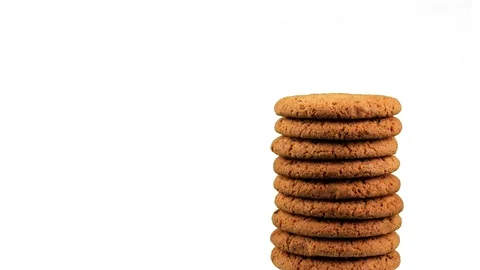 A stack of cookies rotates against a white background. Stock Footage 93435949