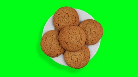 A stack of cookies rotates. A few biscuits on a rotating plate. A white plate Stock Footage 94801478