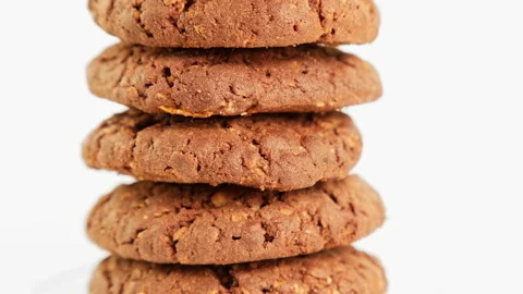 Stack of cookies rotating on white background. Rotating fresh homemade cookies Stock Footage 221395662