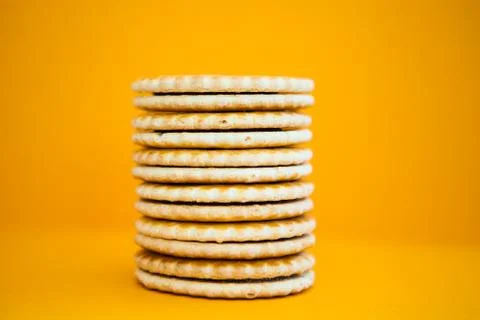 Stack of cookies on the yellow background Stock Photos