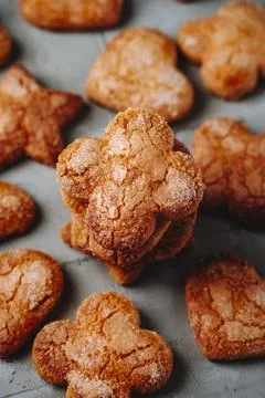A stack of coquetes de sagi with scattered cookies 스톡 사진