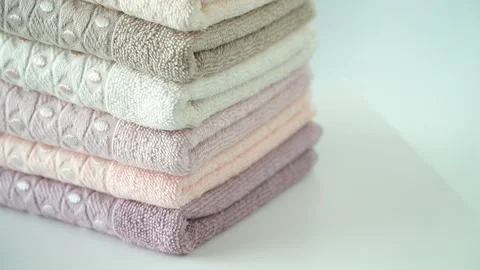 Stack of cotton terry towels rotate on board. Household, bath, hotel, spa 스톡 동영상 138436059