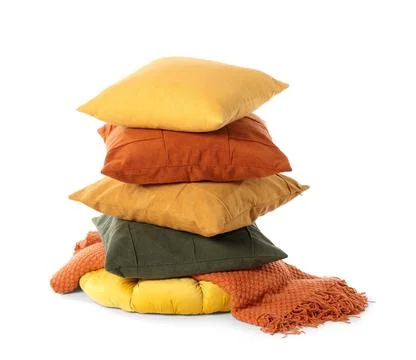 Stack of cozy decorative pillows and soft knitted blanket for home comfort an Fotos de archivo