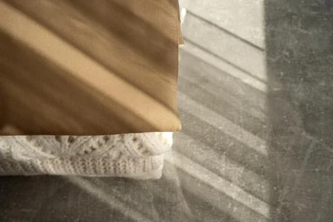 Stack of Cozy Knit Sweaters in Natural Light Stock Photos