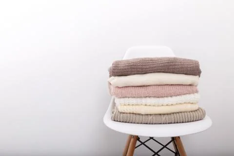 Stack of cozy knitted sweaters Stock Photos