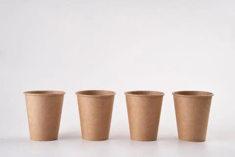 Stack of craft paper to to cups for coffee. Eco friendly take away cup Stock Photos