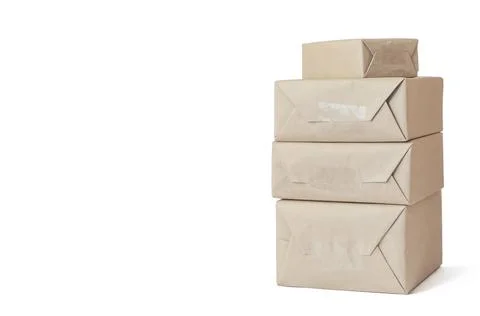 Stack of craft wrapped boxes for deliveryon white background Stock Photos