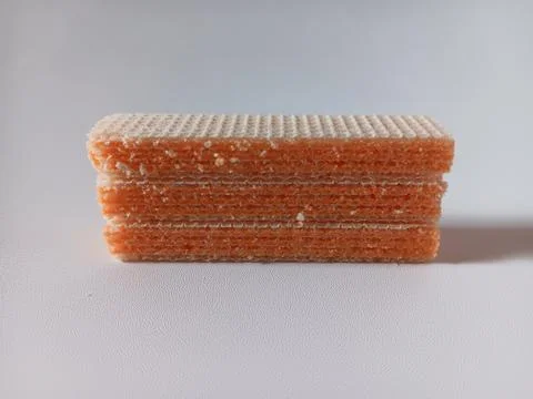 Stack of cream cheese wafers isolated on white background. Stock Photos