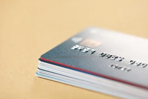 Stack of credit cards on table, closeup. Space for text Stock Photos