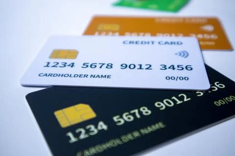 Stack of credit cards on a white surface Stock Photos