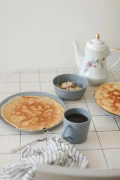 Stack of crepes on kitchen table. Pancakes for breakfast, food photography Stock Photos