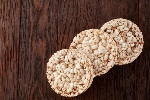 Stack of crispbreads on dark wooden table Stock Photos