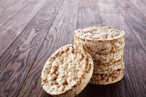 Stack of crispbreads on dark wooden table Foto stock