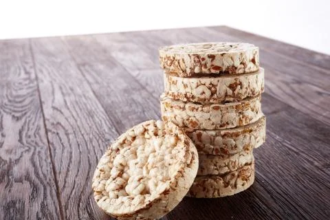 Stack of crispbreads on dark wooden table Foto stock