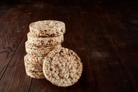 Stack of crispbreads on dark wooden table Foto stock