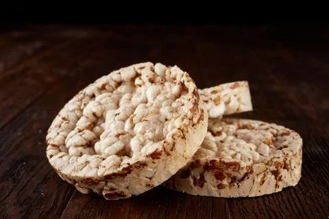 Stack of crispbreads on dark wooden table Foto stock