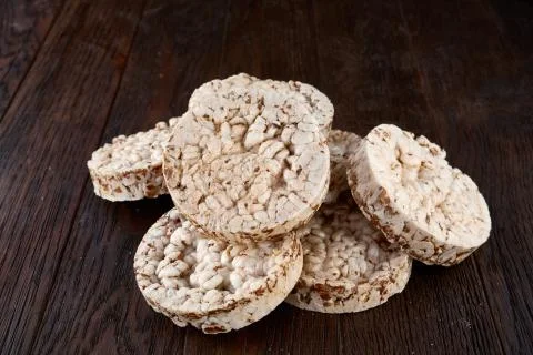 Stack of crispbreads on dark wooden table Foto stock