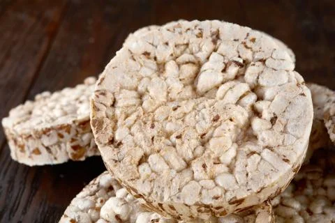 Stack of crispbreads on dark wooden table Stock Photos