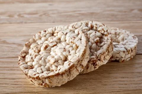 Stack of crispbreads on light wooden table Stock Photos
