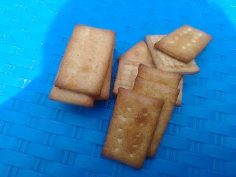Stack of crispy golden brown crackers. 스톡 사진