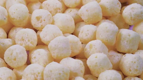 Stack of crispy puffed corn chips. Slider shot. Snacks and Appetizers Stock Footage 296535924