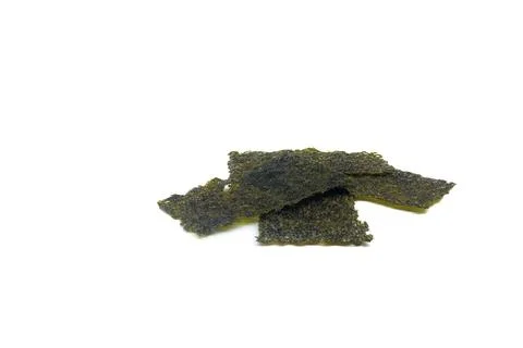 A stack of crispy seaweed snacks on a white background, showcasing their te.. Stock Photos