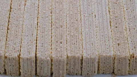 Stack of crispy wafer sticks filled white cream. Slider shot. Stock Footage 296531483