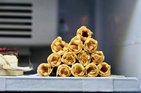 Stack of Crispy Waffle Rolls Filled with Condensed Milk Stock Photos