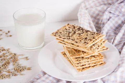 Stack of crispy wheat cakes with sesame, flax and sunflower seeds on on a nap Stock Photos