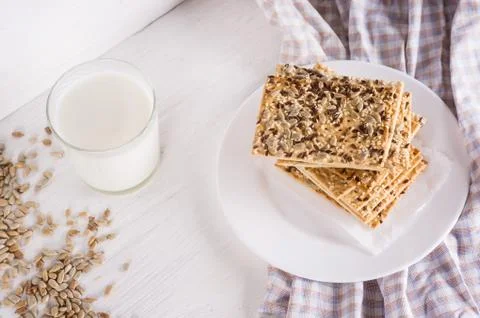 Stack of crispy wheat cakes with sesame, flax and sunflower seeds on on a nap Stock Photos