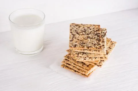 Stack of crispy wheat cakes with sesame, flax and sunflower seeds on on a nap Stock Photos
