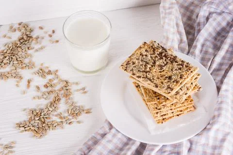 Stack of crispy wheat cakes with sesame, flax and sunflower seeds on on a nap Stock Photos