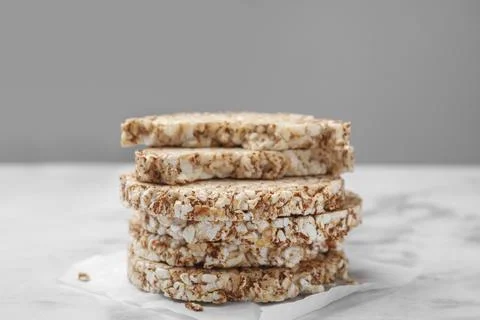 Stack of crunchy buckwheat cakes on white marble table, closeup 스톡 사진