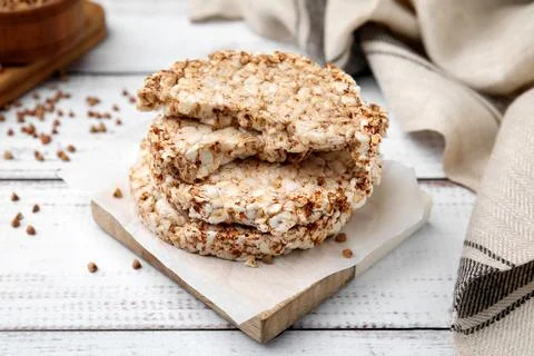 Stack of crunchy buckwheat cakes on white wooden table 写真素材