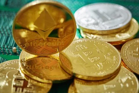 Stack of cryptocurrencies in a circle with ethereum on the top on motherboard Stock Photos