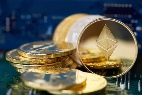 Stack of cryptocurrencies in a circle with ethereum on the top on motherboard Stock Photos