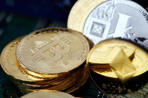 Stack of cryptocurrencies in a circle on motherboard. Cryptocurrency concept Stock Photos