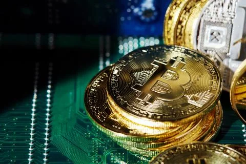 Stack of cryptocurrencies in a circle on motherboard. Cryptocurrency concept Stock Photos