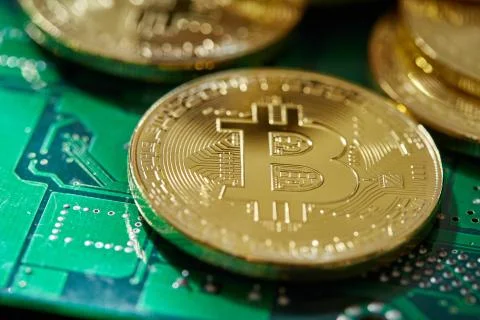 Stack of cryptocurrencies on motherboard. Bitcoin as most important Stock Photos