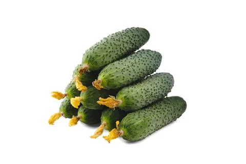 Stack of cucumbers in the shape of a pyramid isolated on white. Foto stock