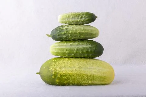 A stack of cucumbers on a white background Stock Photos