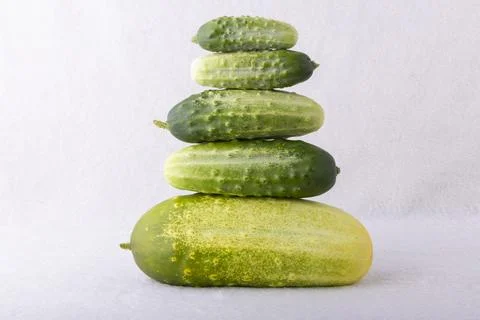 A stack of cucumbers on a white background Foto stock