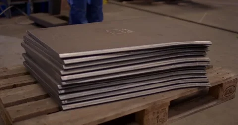 Stack Of Cut Steel Plates On Wooden Pallet, Factory Floor, Static Wide Shot Stock-Footage 340355806