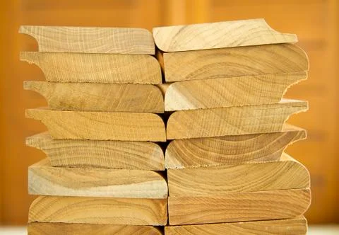 Stack of cutted solid teak wood with wooden background Foto stock