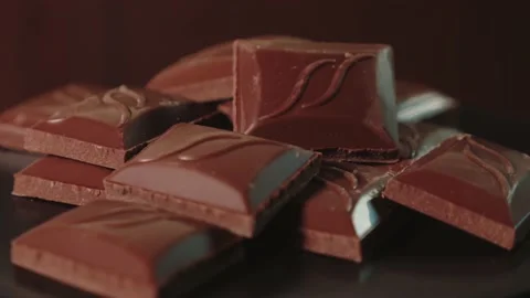 Stack of dark chocolate bars on a rotating stand Stock Footage 165991167