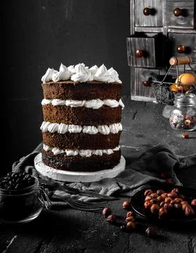 Stack of dark chocolate cake tart in dark background. Foto stock