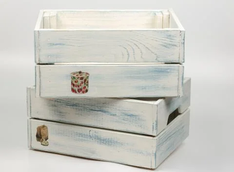Stack of decorative blue wooden boxes on white background Foto stock