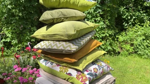 Stack of Decorative Cushions for Cozy Garden Swing Styling Vídeos de archivo 336600329