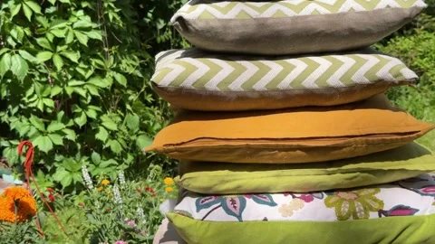 Stack of Decorative Cushions for Cozy Garden Swing Styling Stock Footage 336600446