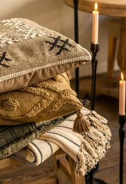 Stack of Decorative Rustic Pillows with Boho Textures and Embroidery Stock Photos